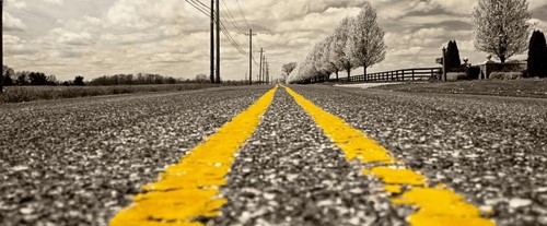 road with fluorescent yellow stripes