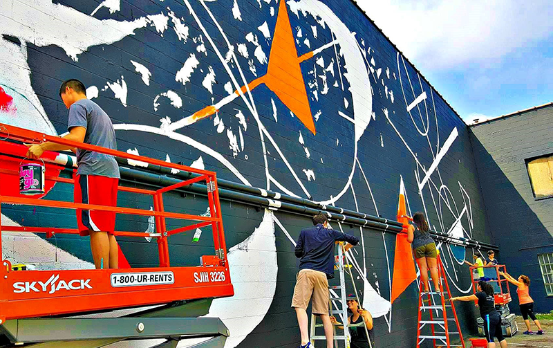 People painting a mural in Cleveland