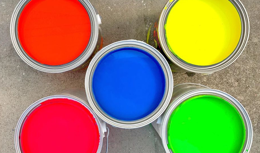 overview of opened fluorescent paint cans