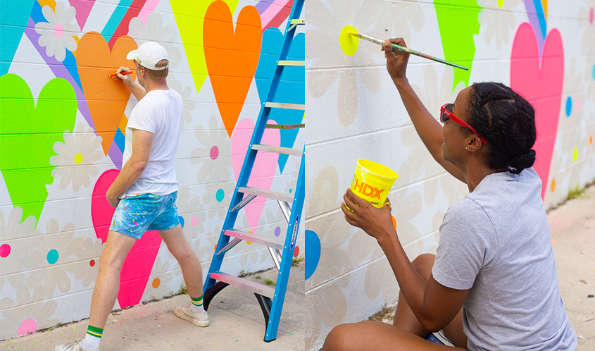 Chris Uphues and woman painting mural