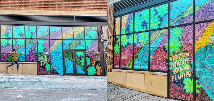 Lisa Quine jumping in front of window painting of flowers and leaves